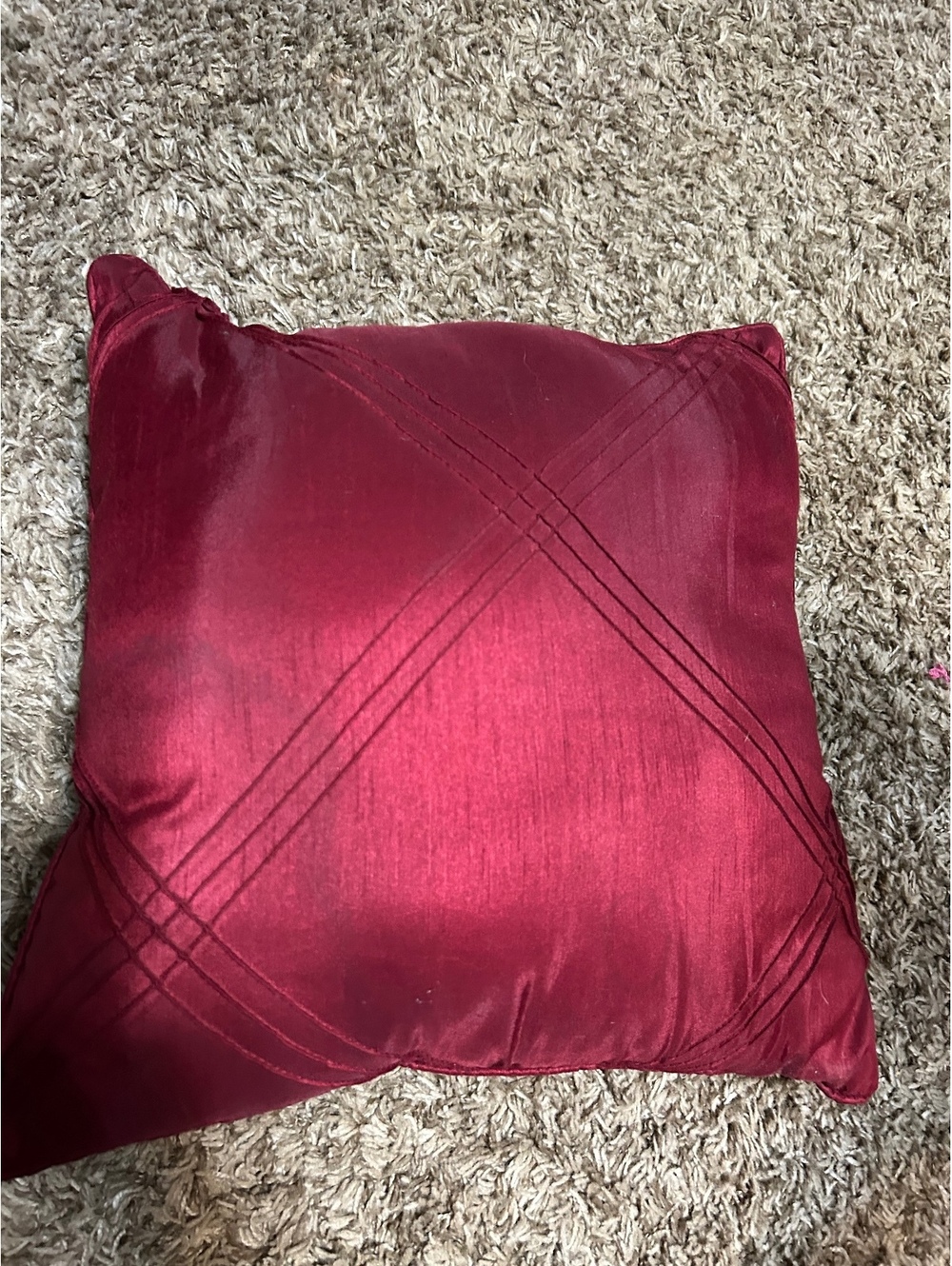Red Decorative Throw Pillow with Stitch Detailing